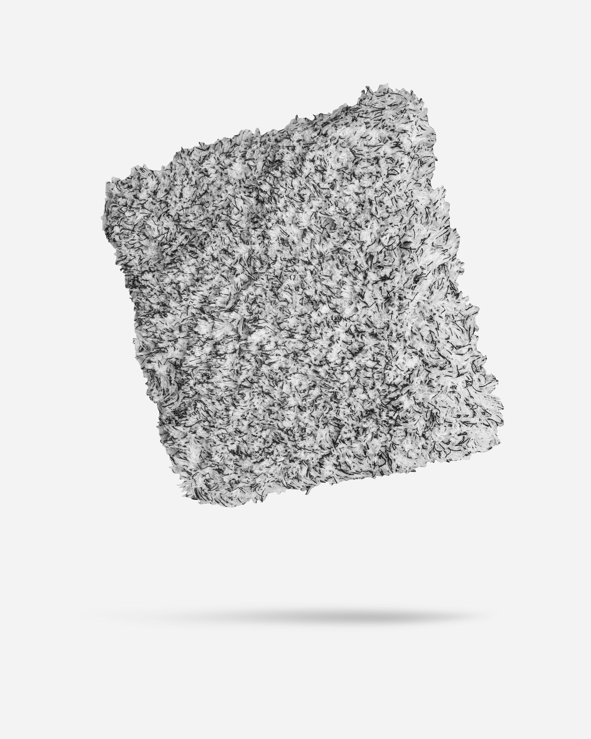 Alt text: "Adam's 10-inch microfiber wash sponge with dense gray fibers, isolated on a white background."